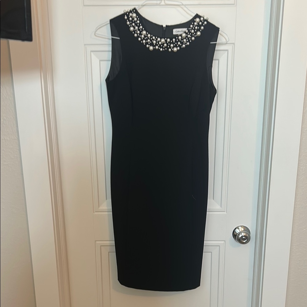 Elegant Black Dress with Pearl Embellishments